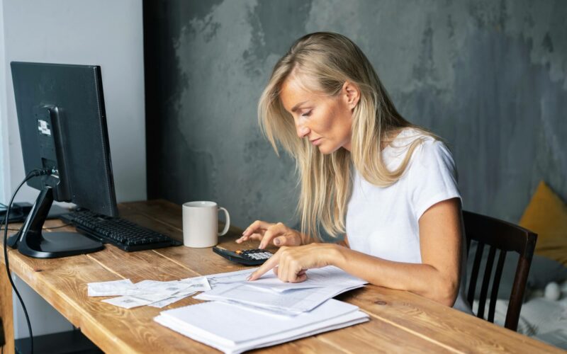 business-woman-at-her-desk-does-the-bookkeeping-settles-bills-and-controls-the-business.jpg business-woman-at-her-desk-does-the-bookkeeping-settles-bills-and-controls-the-business.jpg