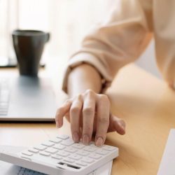 close-up-view-of-bookkeeper-or-financial-inspector-hands-making-report-calculating-or-checking.jpg